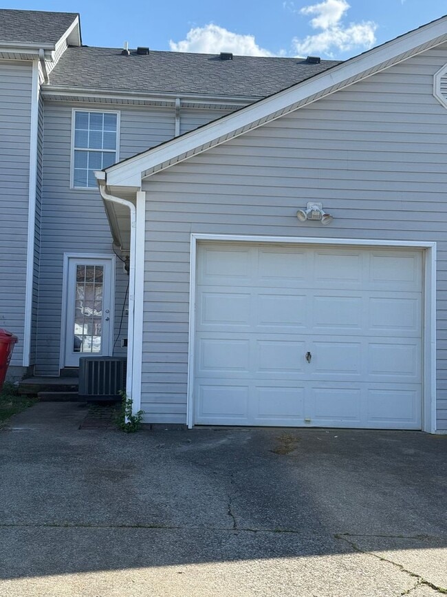 Building Photo - 2-bedroom, 1.5-bath townhouse with an attached garage
