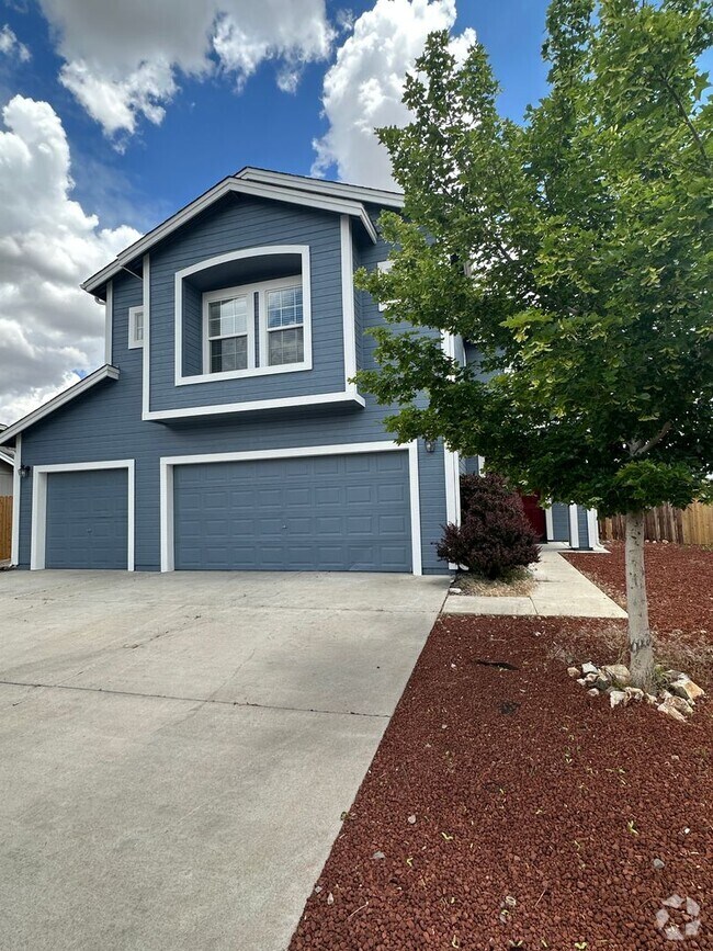 Building Photo - 4 bedrooms, 2 1/2 Baths with a 3 Car Garag...