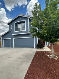 Building Photo - 4 bedrooms, 2 1/2 Baths with a 3 Car Garag...