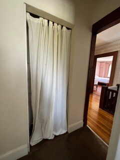 Curtain closed on cleaning closet, and hallway from kitchen - 2615 Parker St