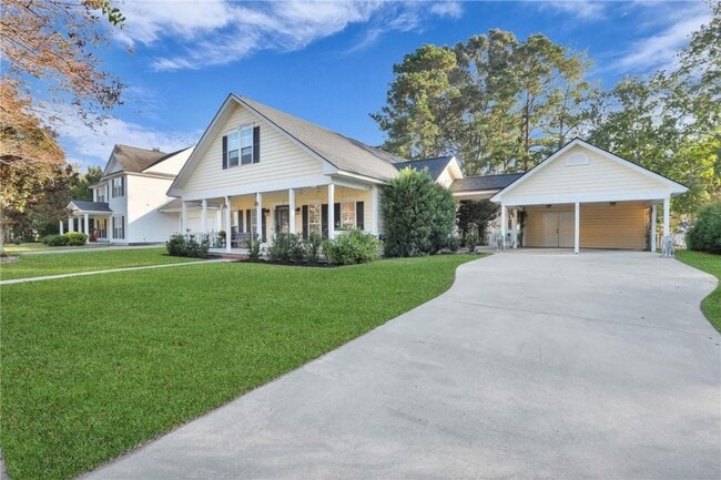 Building Photo - 4-Bedroom Home in Wild Heron with Front Porch and Fenced Yard