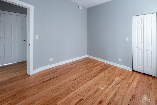 Building Photo - Modern 4BR Apartment with Hardwood Floors, Balcony & Central A/C