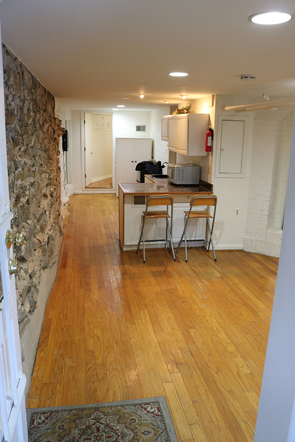 View as one enters the apartment, living room, kitchenette, extra area, doorway to bedroom - 3118 Dumbarton St NW