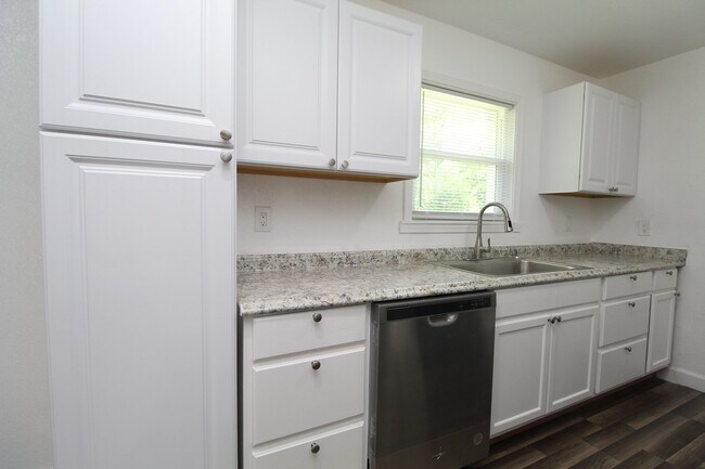 Building Photo - 4BR Home with LVP Flooring, Open Layout & Large Backyard Near Dogwood