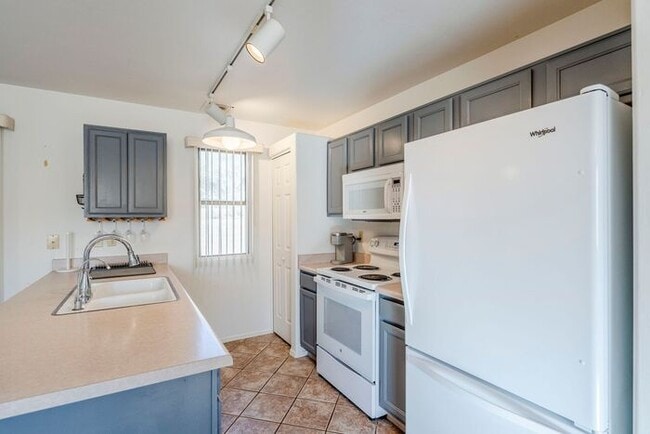 Building Photo - Turnkey Charm in Green Valley – Furnished Townhome with Gated Serenity!