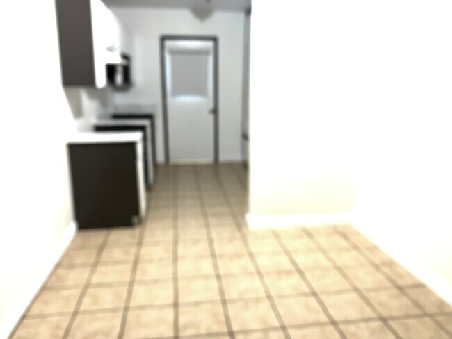 Kitchen room left side view to back door - 14714 Strathern St