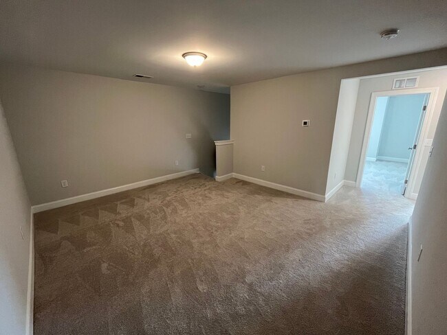 Building Photo - Newly Built 4BD, 3BA Cary Townhome with Modern Amenities and Screened-In Patio