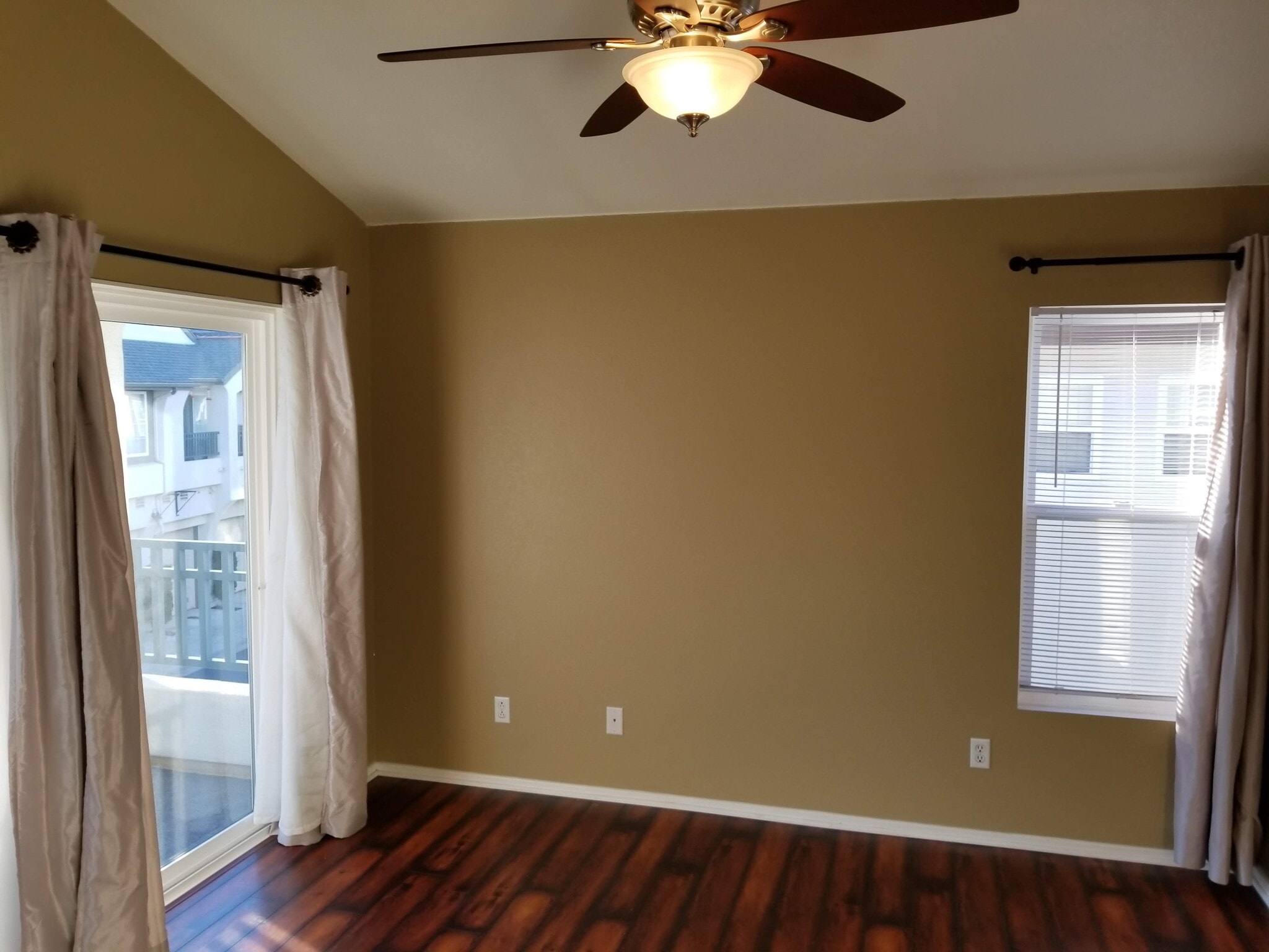 Master bedroom with vaulted ceiling and overhead fan - 16939 Robins Nest Way