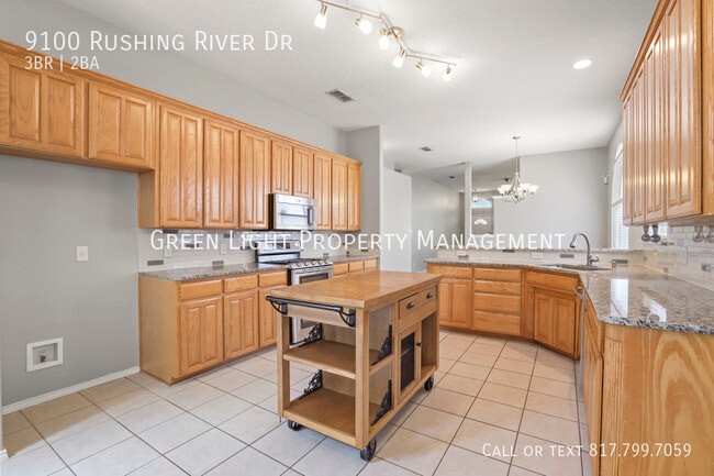 Building Photo - 9100 Rushing River Dr