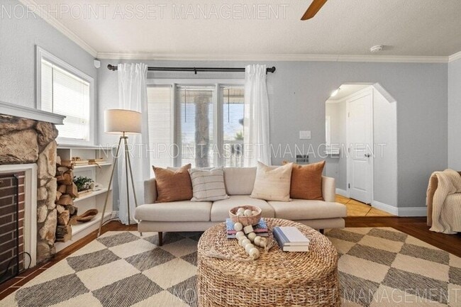 Building Photo - Welcome to this stunning 4-bedroom, 2-bath...
