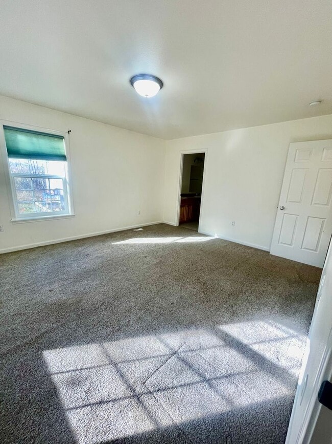 Building Photo - Ranch style 3bedroom/2 bathroom with an Oversized two car garage +giant carport!  Large private l...
