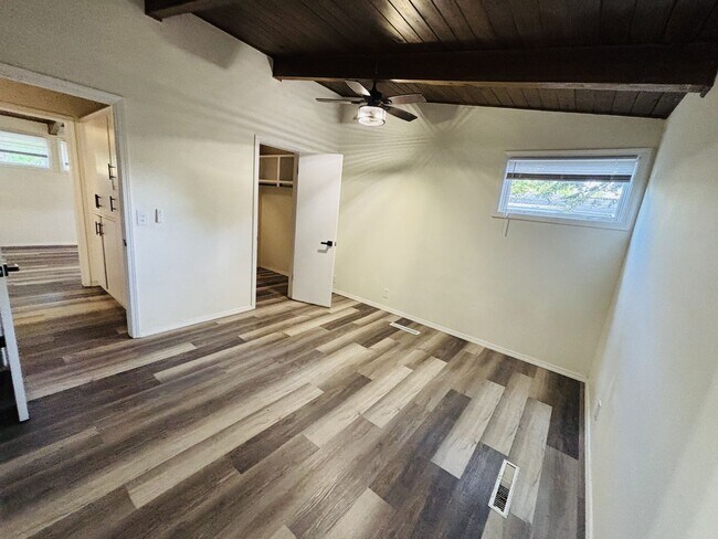 Building Photo - Quirky Mid-Century 3BR with High Beam Ceilings + Fenced Yard – $1,550