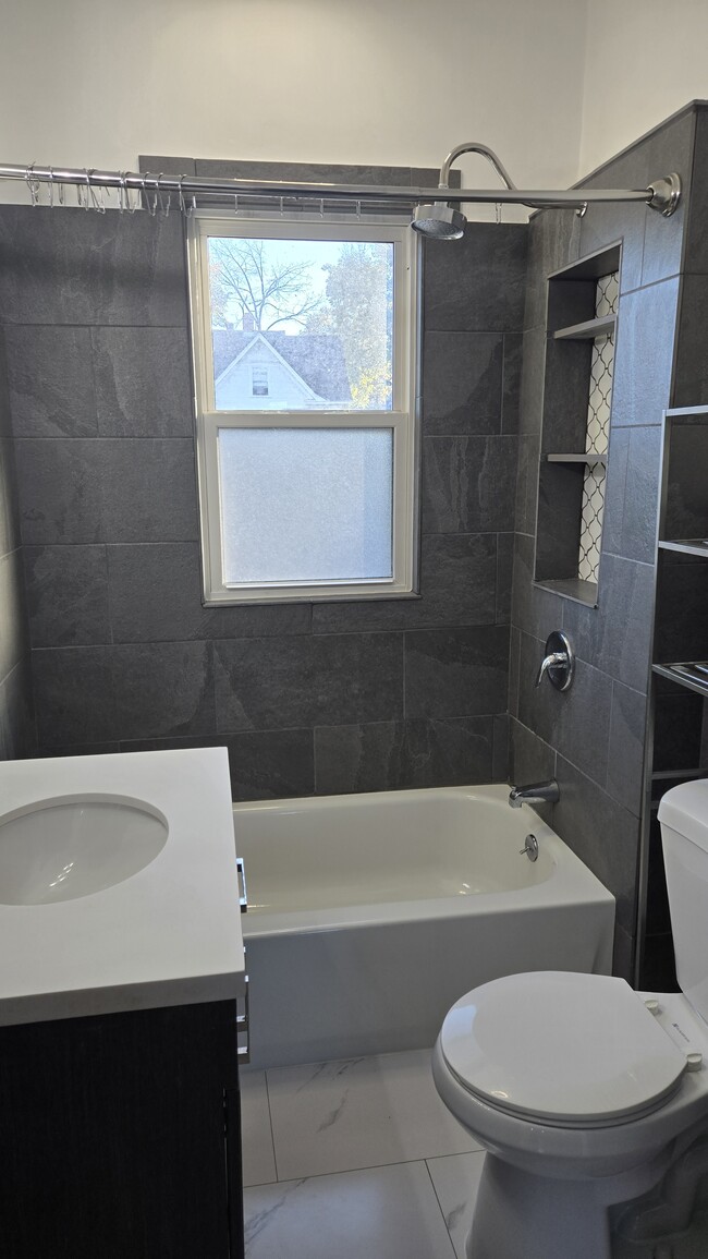 Check out this beautifully updated bathroom! - 533 Smith Ave S