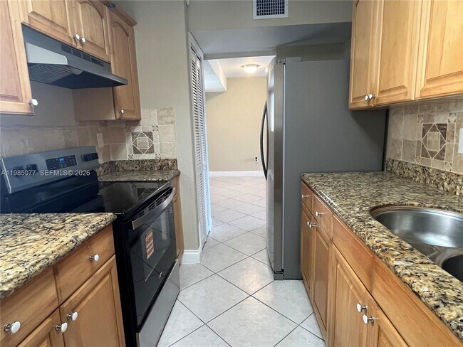 Building Photo - 6091 W 22nd Ct