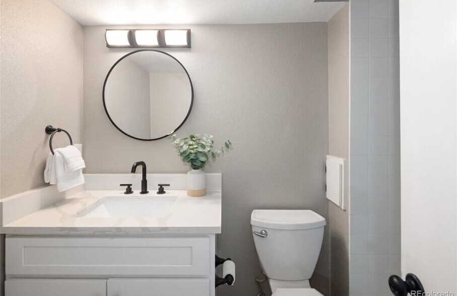 Downstairs bath - 10587 W Maplewood Dr