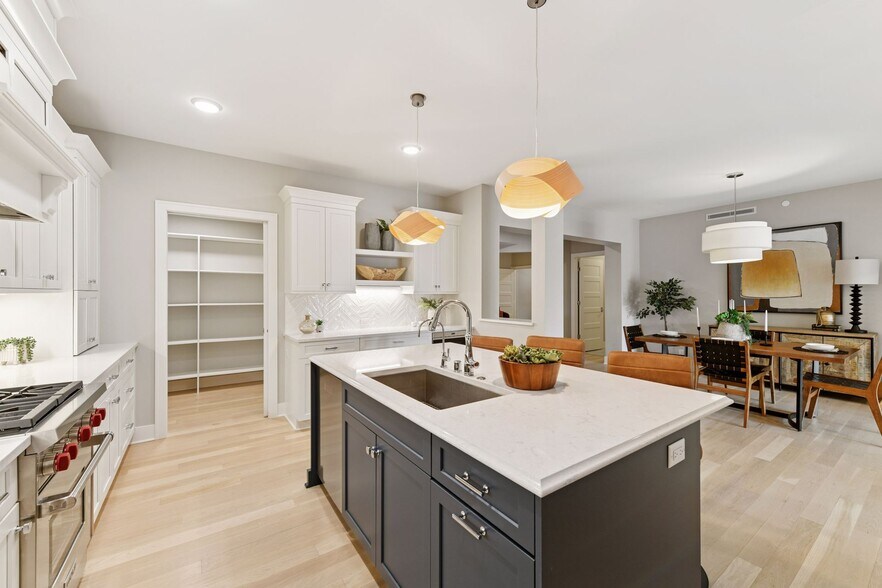 Bright kitchen opens to other main areas of the unit - 222 Ferndale Rd S