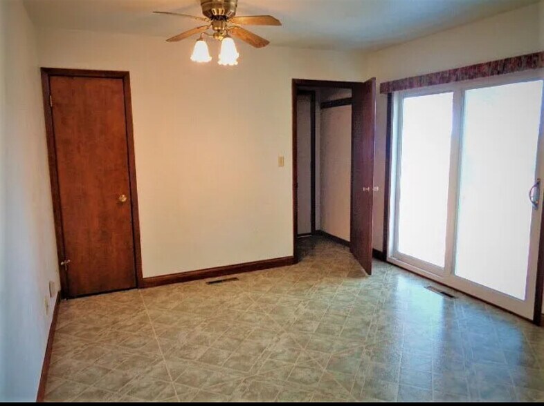 Kitchen dining area with pantry (left) and door to garage/basement - 312 N Main St