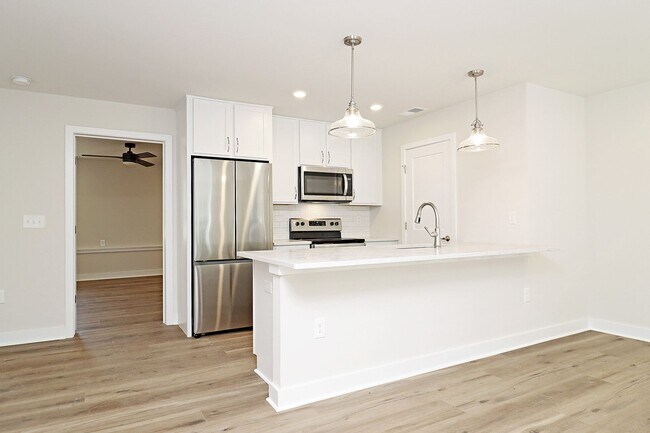 Building Photo - $1,000 Off 1st Month's Rent! Dog-Friendly End-Unit Apartment