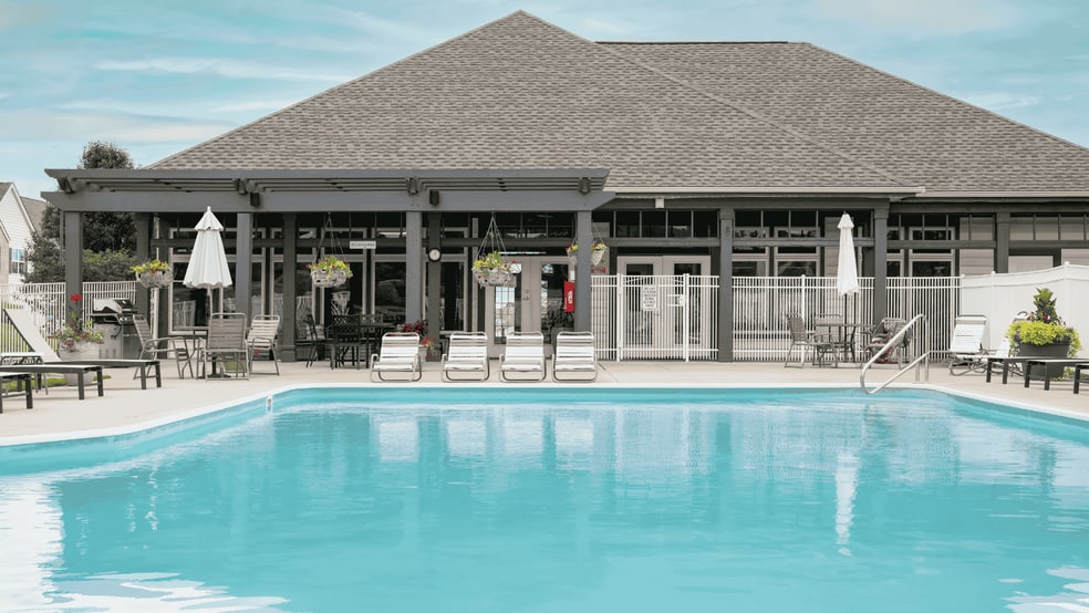 Kick back and unwind poolside with friends. - Catalina Club Apartments