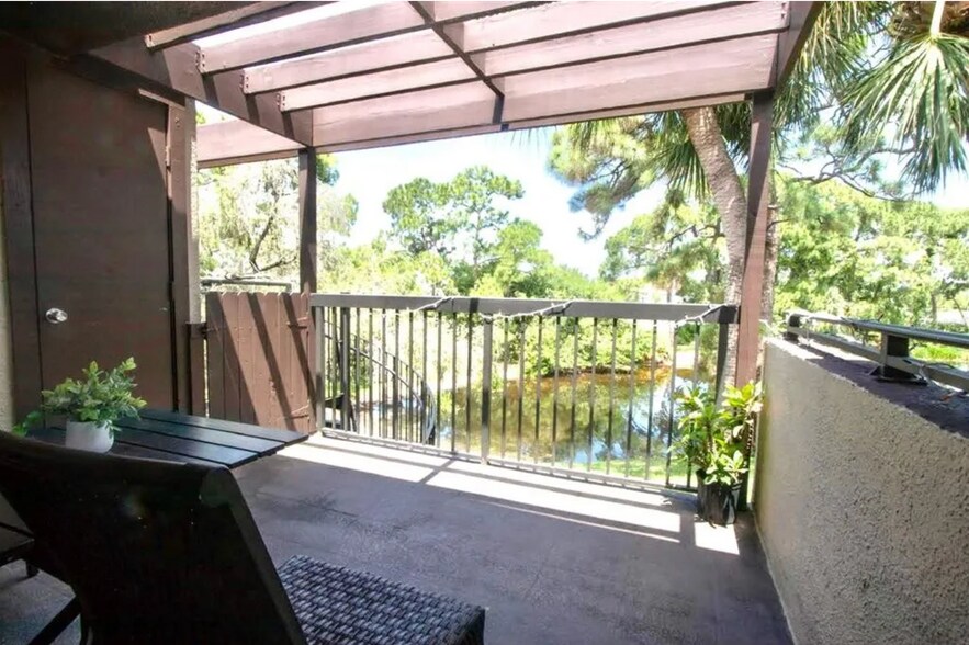 rear balcony pond view - 880 S Village Dr N