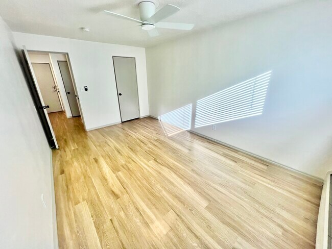 Experience the brightness and openness of this inviting living space. - Harmony Apartments