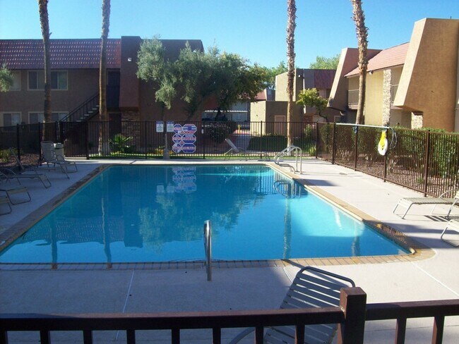 Building Photo - 2nd floor unit in upscale guard gated SW complex near Strip