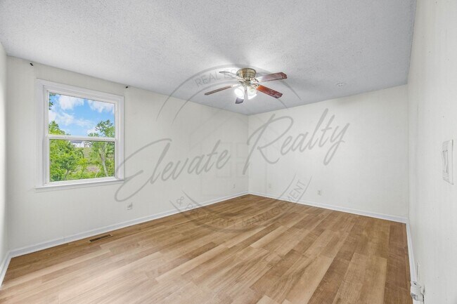 Building Photo - Four Bedroom Two Story with Two Car Garage...