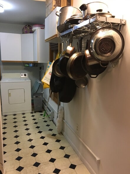 Kitchen leads to laundry and stairs to Primary Suite. - 39 Burling St