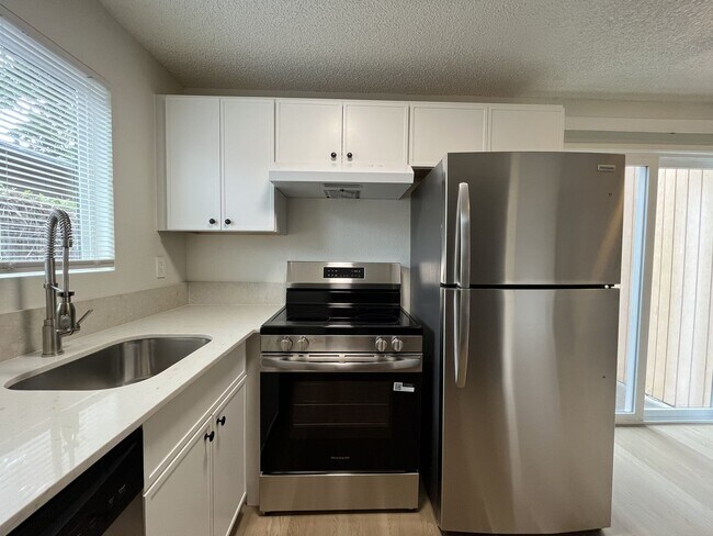 Building Photo - Inviting 2 Bedroom Home with Open Layout, Stainless Steel Appliances & Private Outdoor Retreat