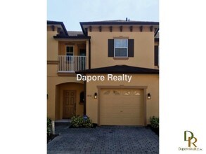 Building Photo - Spacious Gated Townhouse with Garage, Community Pool, and More!