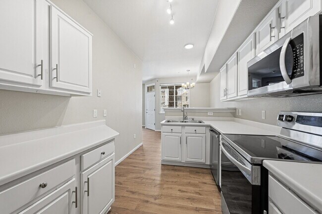 Building Photo - $1,745.95 - Ground-Level 1 Bed + Flex Room | 1.5 Bath Condo with Community Pool