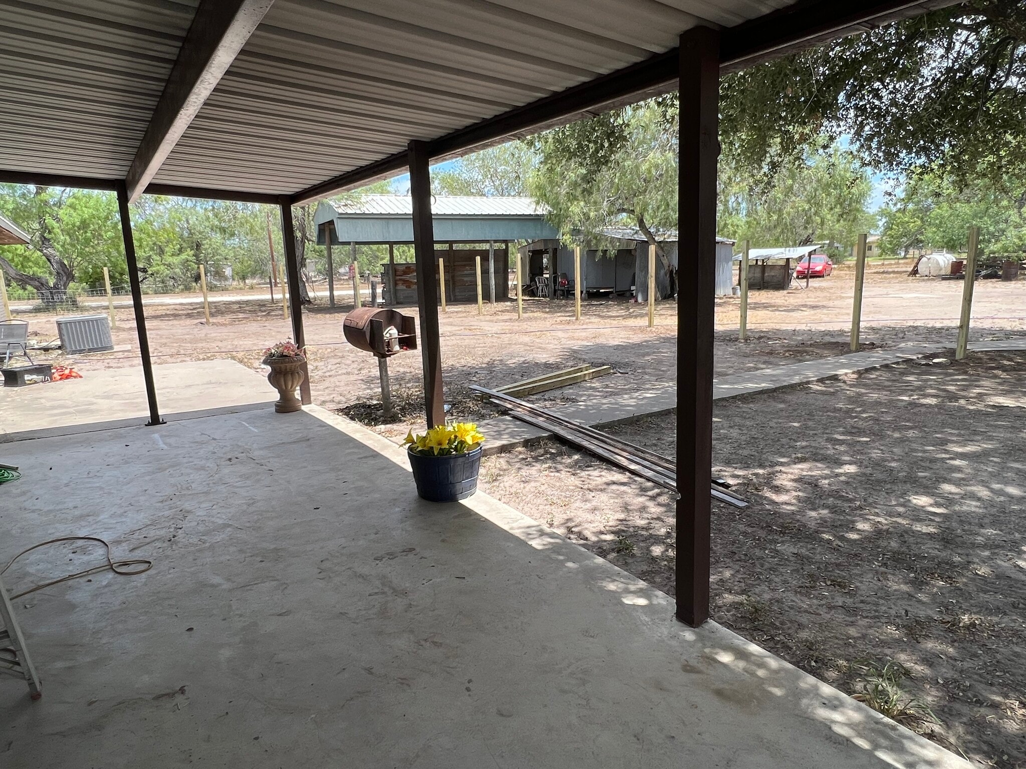 Covered patio. Backyard fence is being built. - 271 W County Road 2140