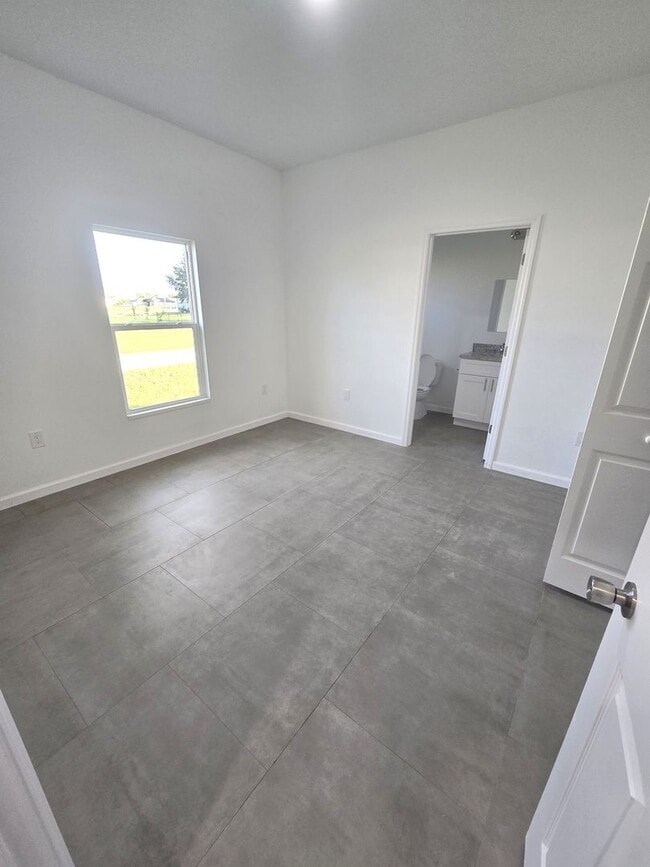 Building Photo - Brand-New 2/2/1 -SW Lehigh Acres-See this ...