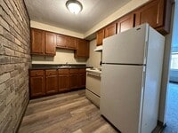 Building Photo - Amazing 1 Bedroom with Beautiful Exposed Brick! Off-Street Parking & Laundry Included!