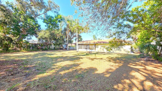 Building Photo - SPACIOUS SARASOTA HOME WITH LARGE FENCED YARD! MOVE IN READY! ALL TILE/ NEW LVP!