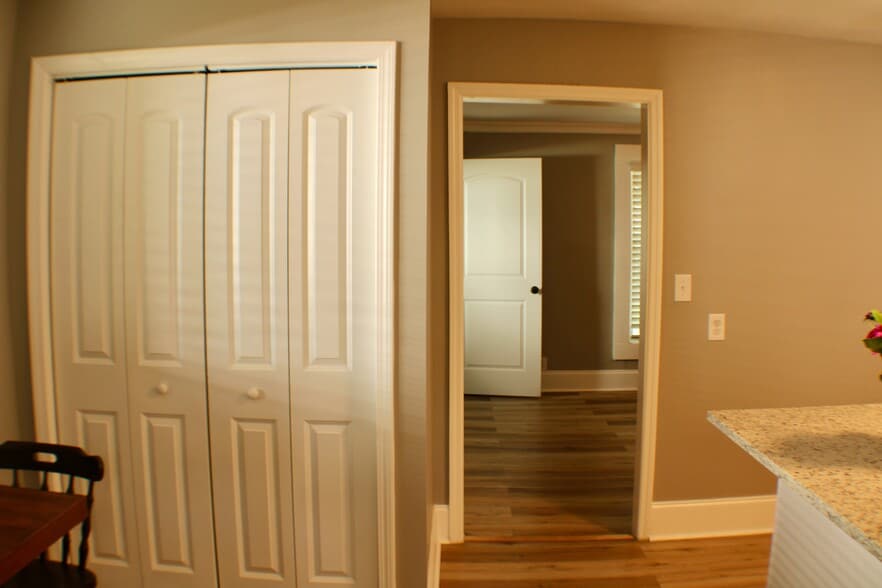 Closed pantry doors with exit from kitchen back to the living room/multi-purpose room - 311 Paris Mountain Ave
