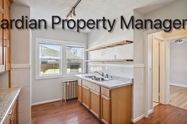 Building Photo - Linden Hills Side By Side, Hardwood Floors, Attached Garage, New Efficient Heating System, Pets W...