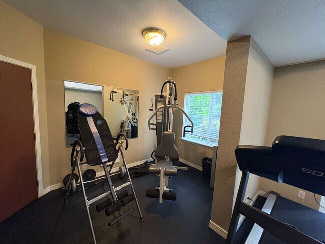 Building Photo - Bright, Modern 1BR Near Hospitals, SU & Transit in secure building with garage parking and a Walk...