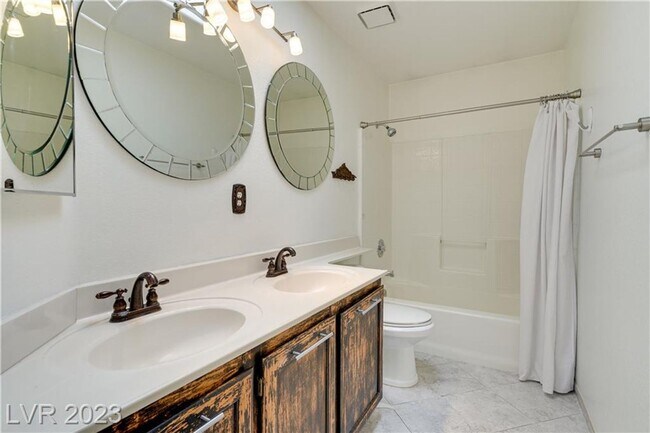 Building Photo - 4 BEDROOM HOME WITH PRIMARY BEDROOM DOWNST...