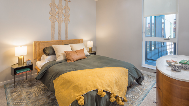 Spacious bedrooms with custom roller shades - Modera LoHi