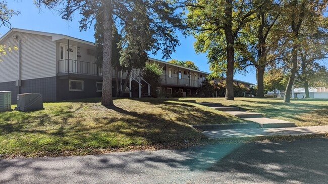 Building Photo - Conveniently located Riverbend Apartments feature a quiet community with a large green space