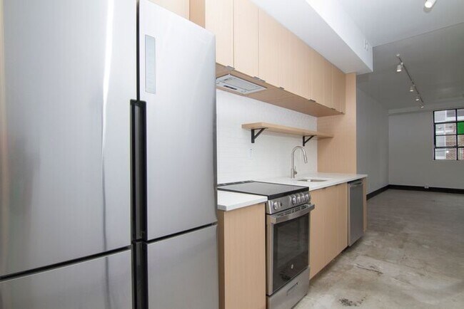 Building Photo - Check out this studio ! We want you to cal...