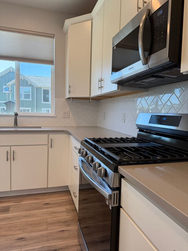 Building Photo - Stunning Luxury Living in Coal Creek with ...