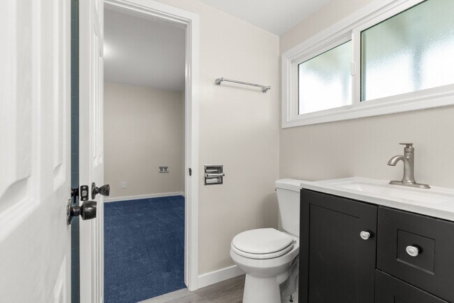 Building Photo - Charming Updated Home With Drive-Through Garage Access