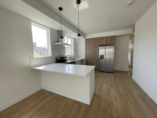Building Photo - JUST COMPLETED MODERN TOWNHOMES! Never Liv...