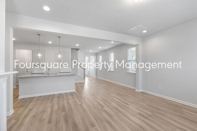 Building Photo - Bright 3-Bed 2.5-Bath End-Unit Townhome with Washer/ Dryer, Granite Kitchen & 2-Car Garage.Conven...