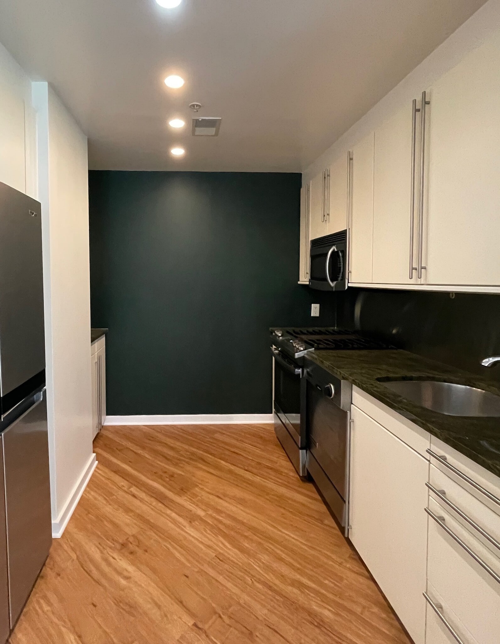 new flooring, wall color and fridge. Dishwasher has also since been updated since this pic was taken - 1300 13th St NW