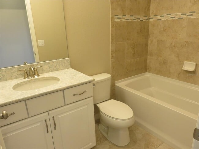 Building Photo - 8828 Tropical Palm Dr