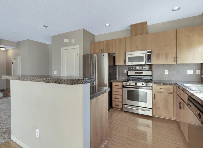Building Photo - 2BR + 2.1BA Corner Townhome-Style Condo — Dual Primary Suites, Attached Garage & Most Utilities I...