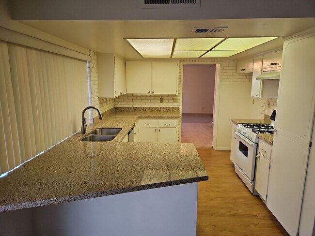 Building Photo - Spacious 4-Bedroom Home with Large Backyard & Covered Patio!